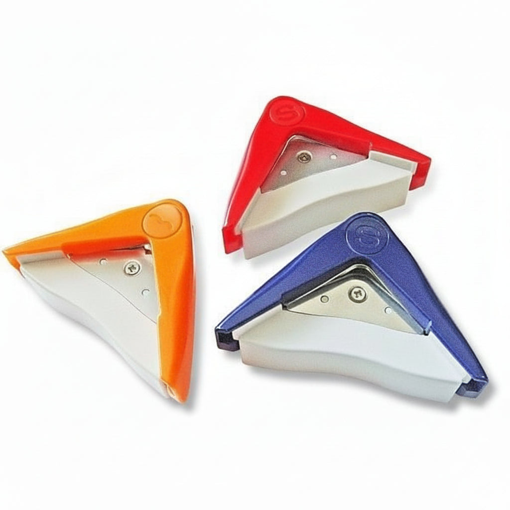 Three triangular corner paper trimmers used for stamp mount, photos or documents in red, orange, and blue on a white background