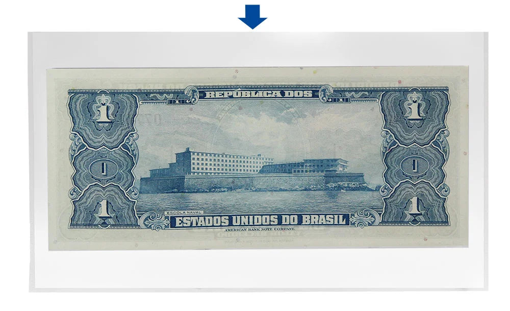 Vintage Brazilian banknote with blue and green design inside a protective sleeve with a blue arrow pointing to the top on a white background