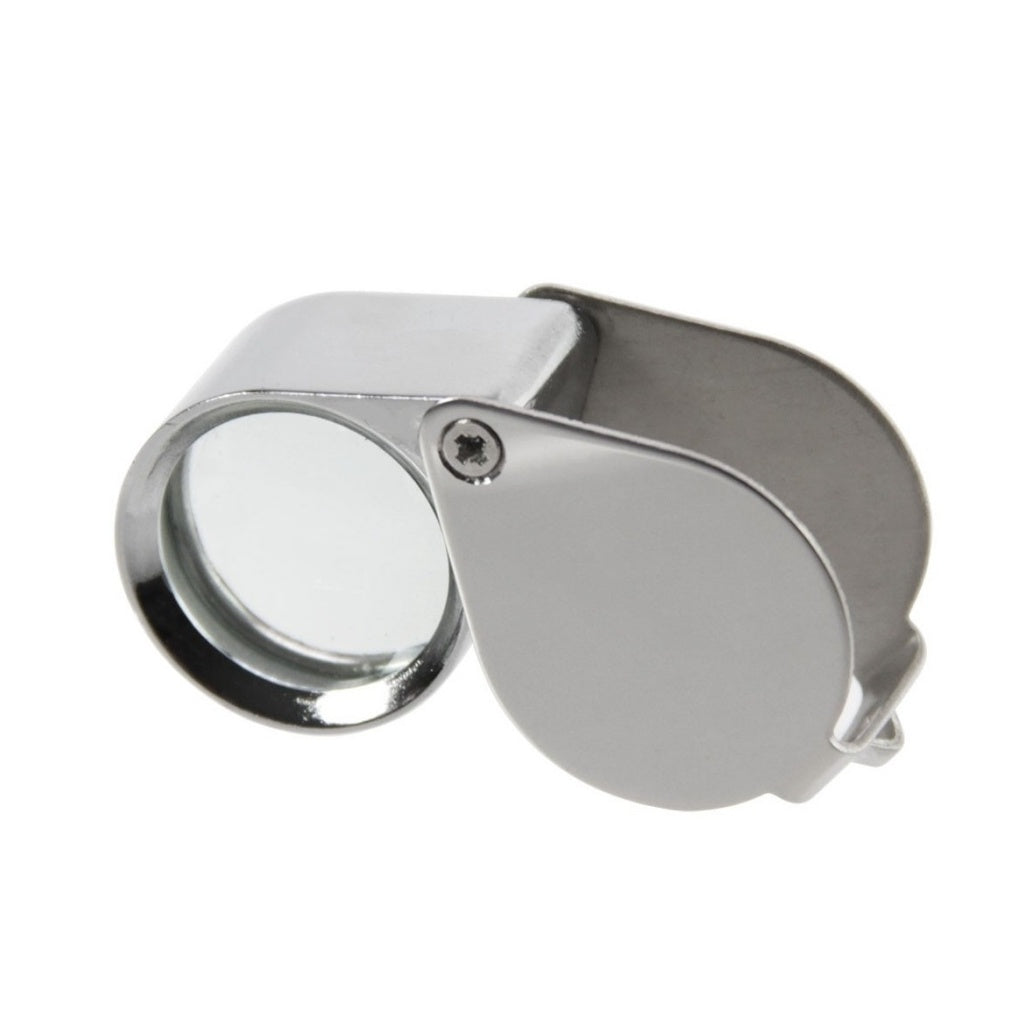 Silver magnifying glass loupe on a white background