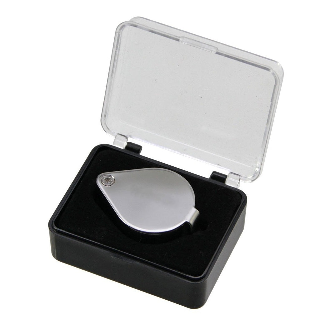 Silver magnifying glass loupe inside a protective case with a clear lid on a white background