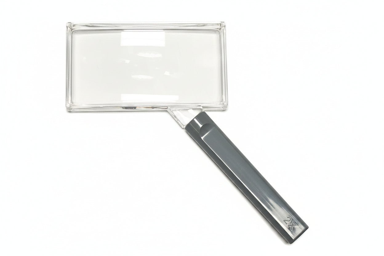 Rectangular magnifying glass with gray handle on a white background