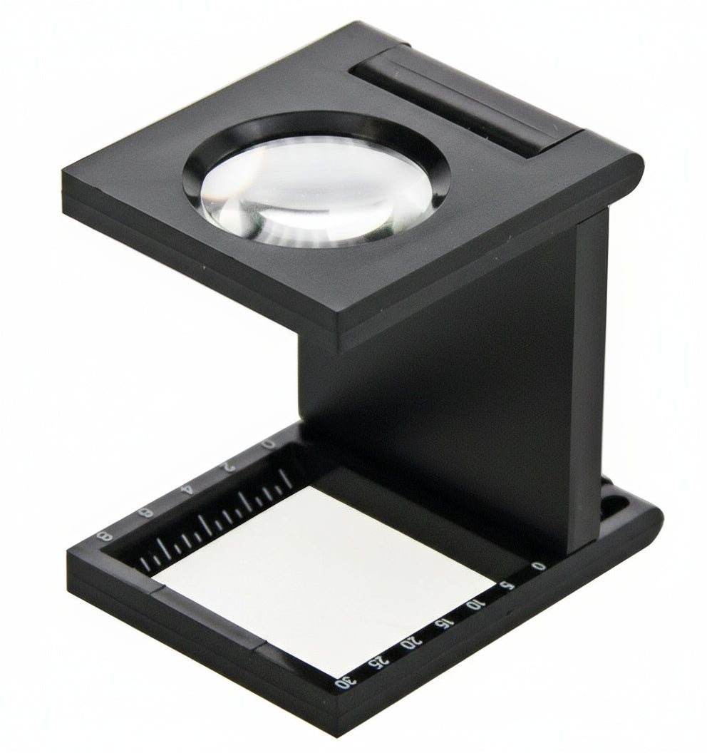 Hands-free foldable magnifier with measuring scale on a white background