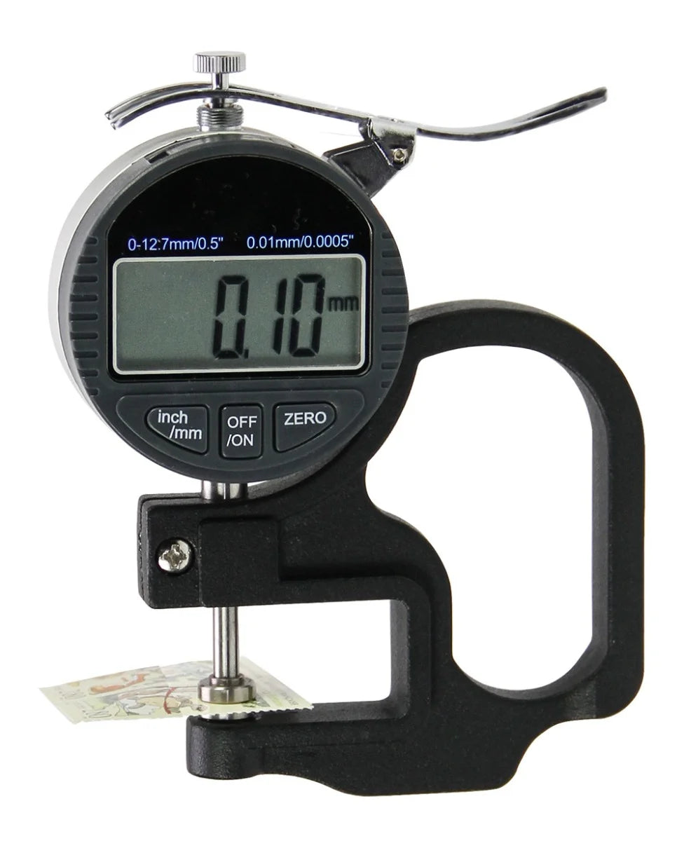 Digital thickness indicator with a digital screen, black handle and the clamp mechanism measuring the thickness of a stamp on a white background