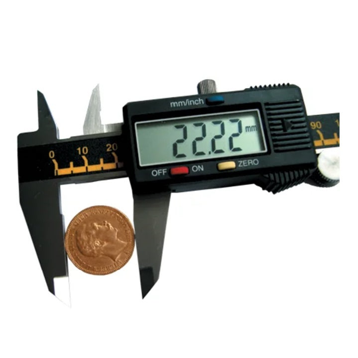 Digital caliper measuring a coin on a white background