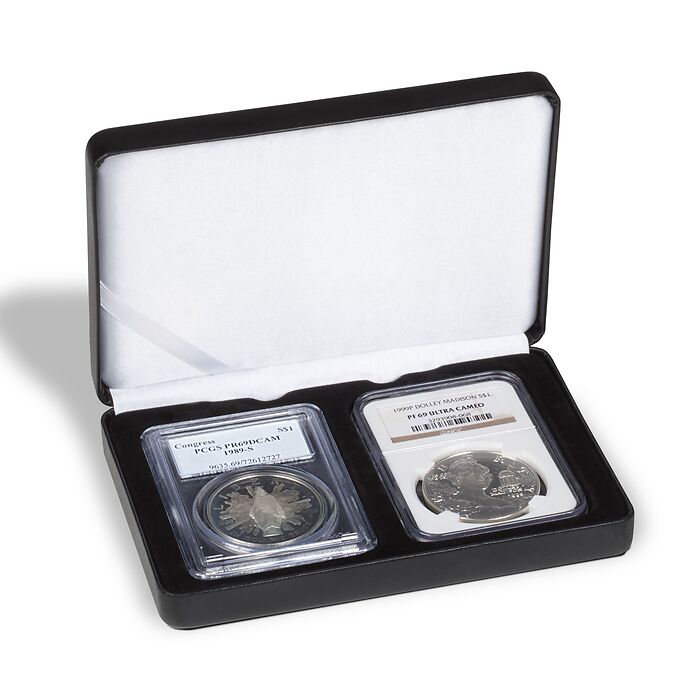 Open black coin case with a white silky interior displaying two graded coin slabs on a black insert on a white background