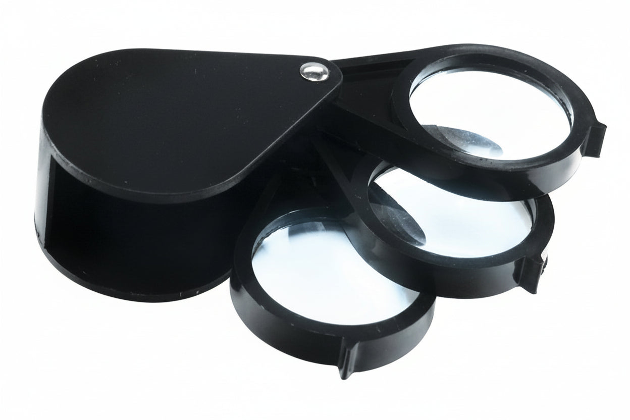 Black magnifier with three lenses on a white background