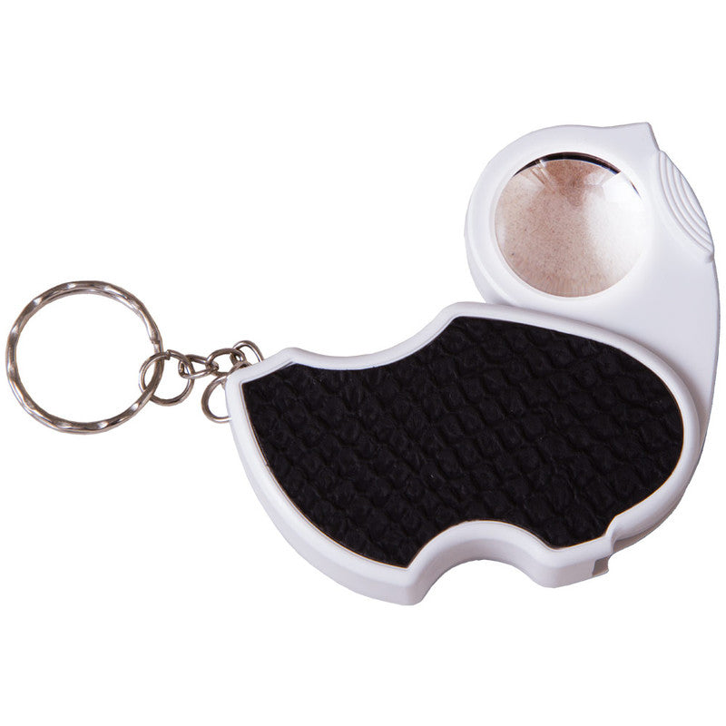 White and black loupe magnifier with a keychain ring on a white background