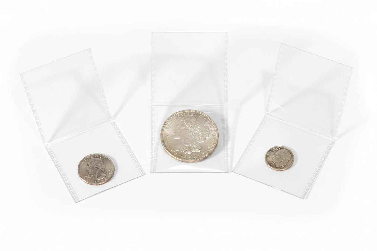 Three crystal-clear SAFLIP coin holders with coins on a white surface