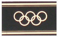 Olympic rings logo embossed in gold on a black label for album spine labeling/organizing on a white background
