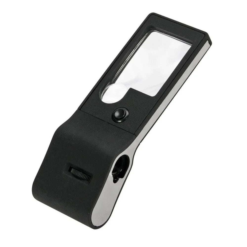 Two lens, hand-held black magnifying glass with LED and UV light with focus wheel on a white background