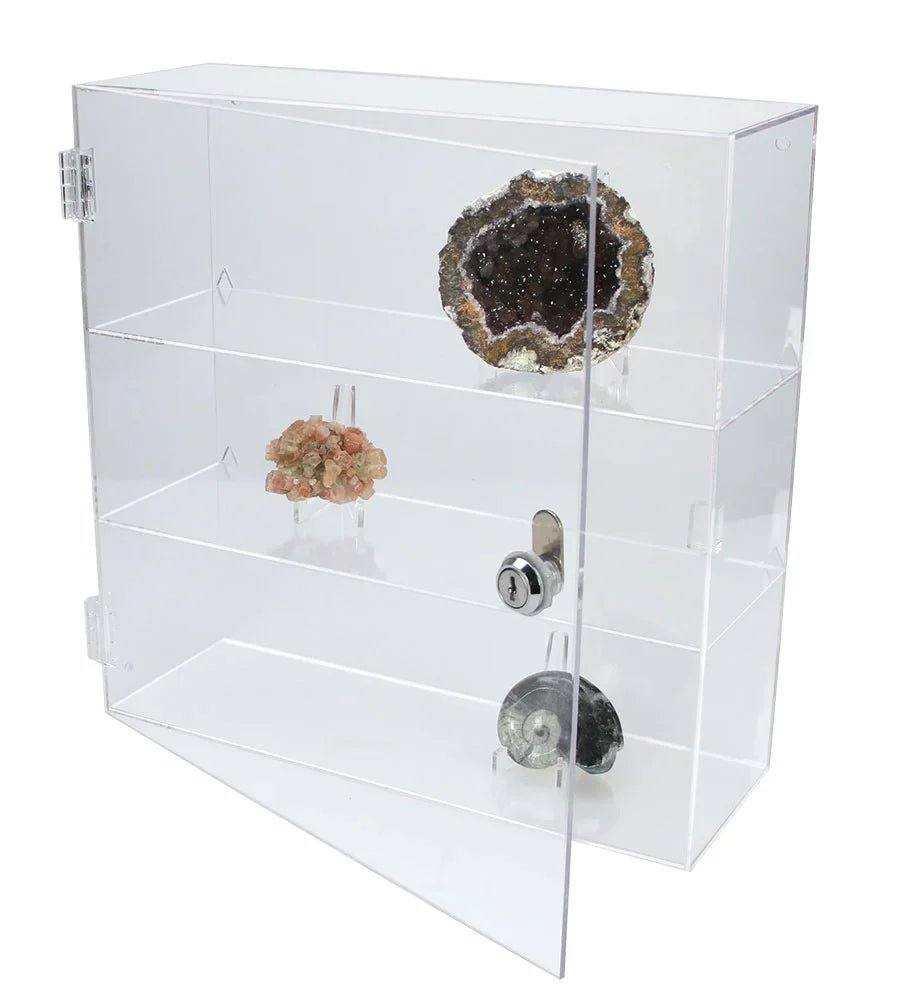 Clear acrylic display curio with multiple shelves holding a collection of rocks, minerals & geodes on a white background