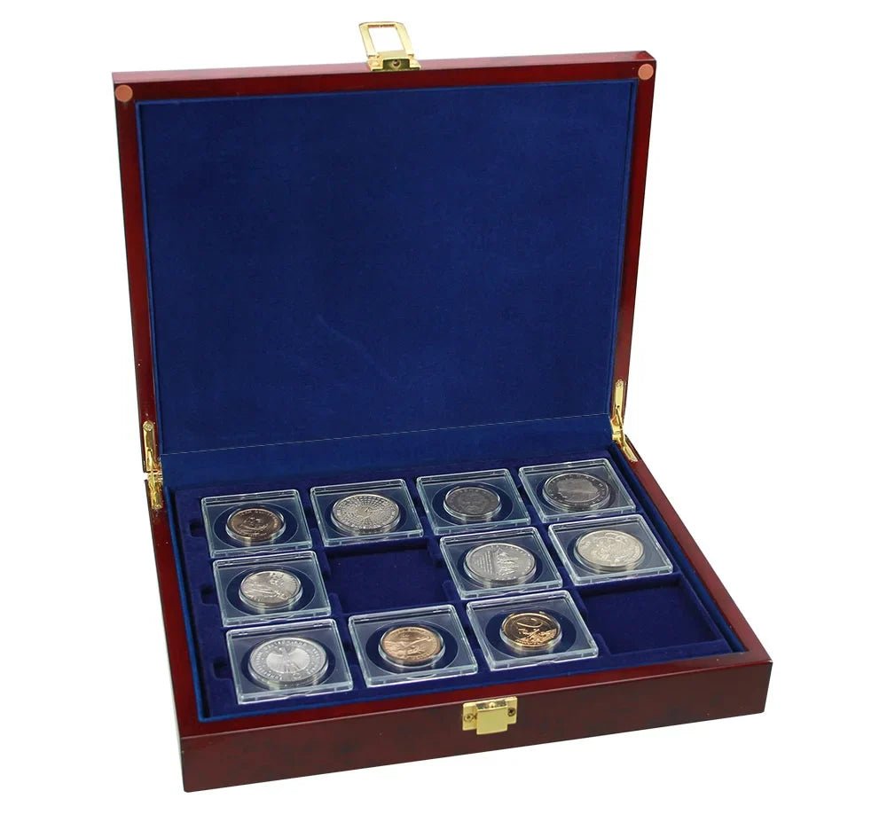 Open burlwood coin collection box with blue velvet trays holding a 2x2 coin flip collection on a white background