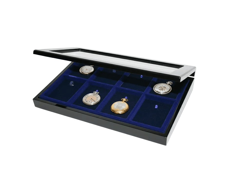 Antique pocket watches on a blue velvet tray inside of a black wooden high gloss display case with the acrylic glass lid open ajar on a white background