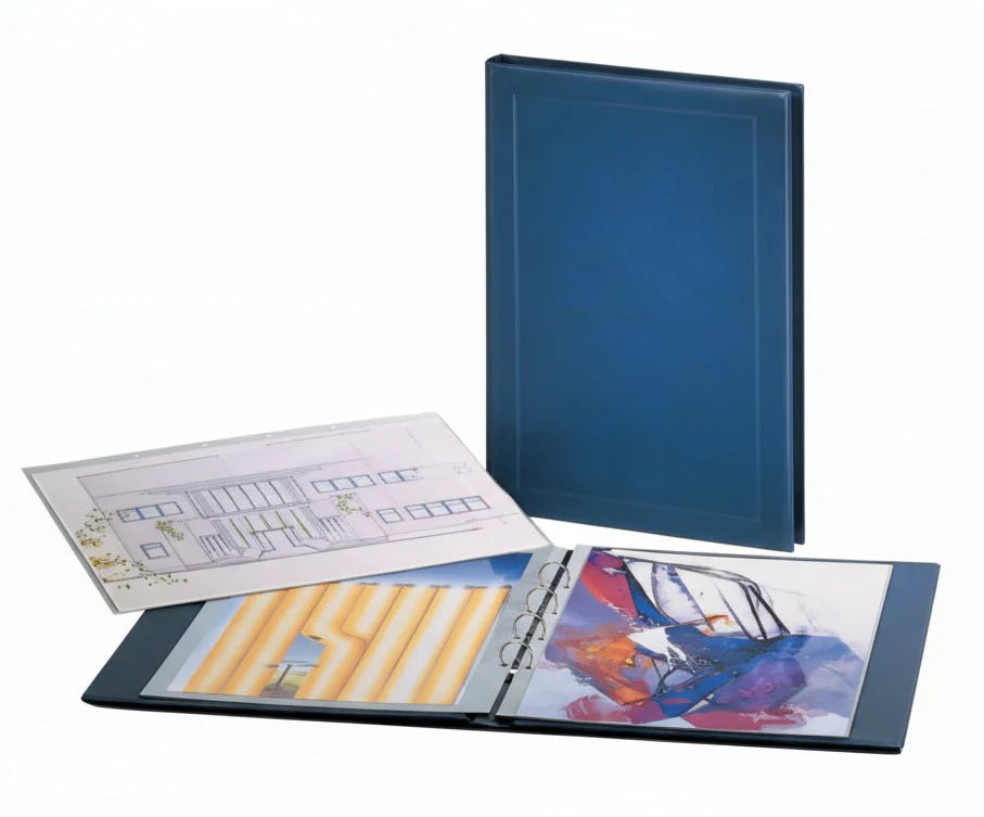 Giant blue collector album with open pages showing colorful artwork and blueprints on a white background