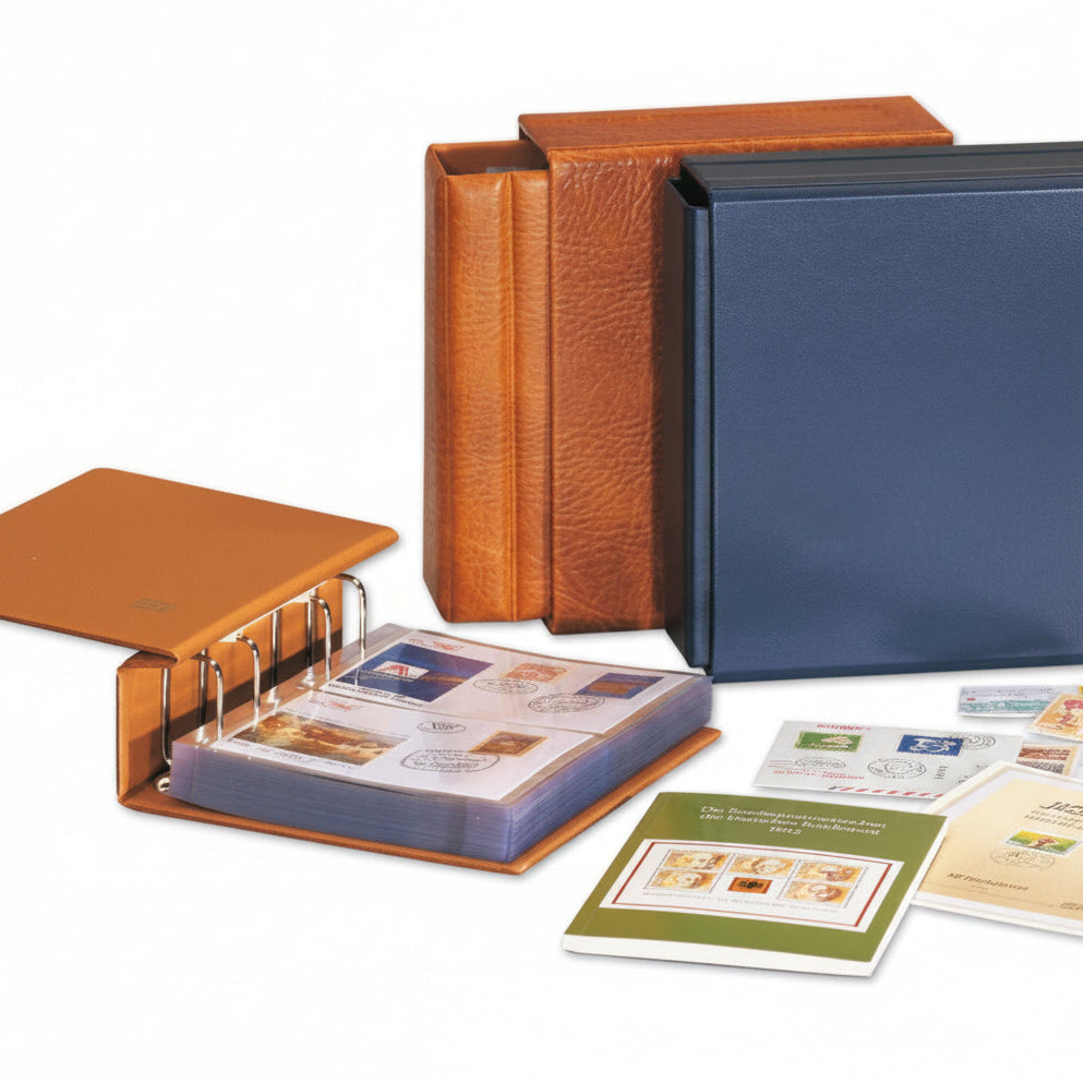 Collection of stamp albums and binders on a white background