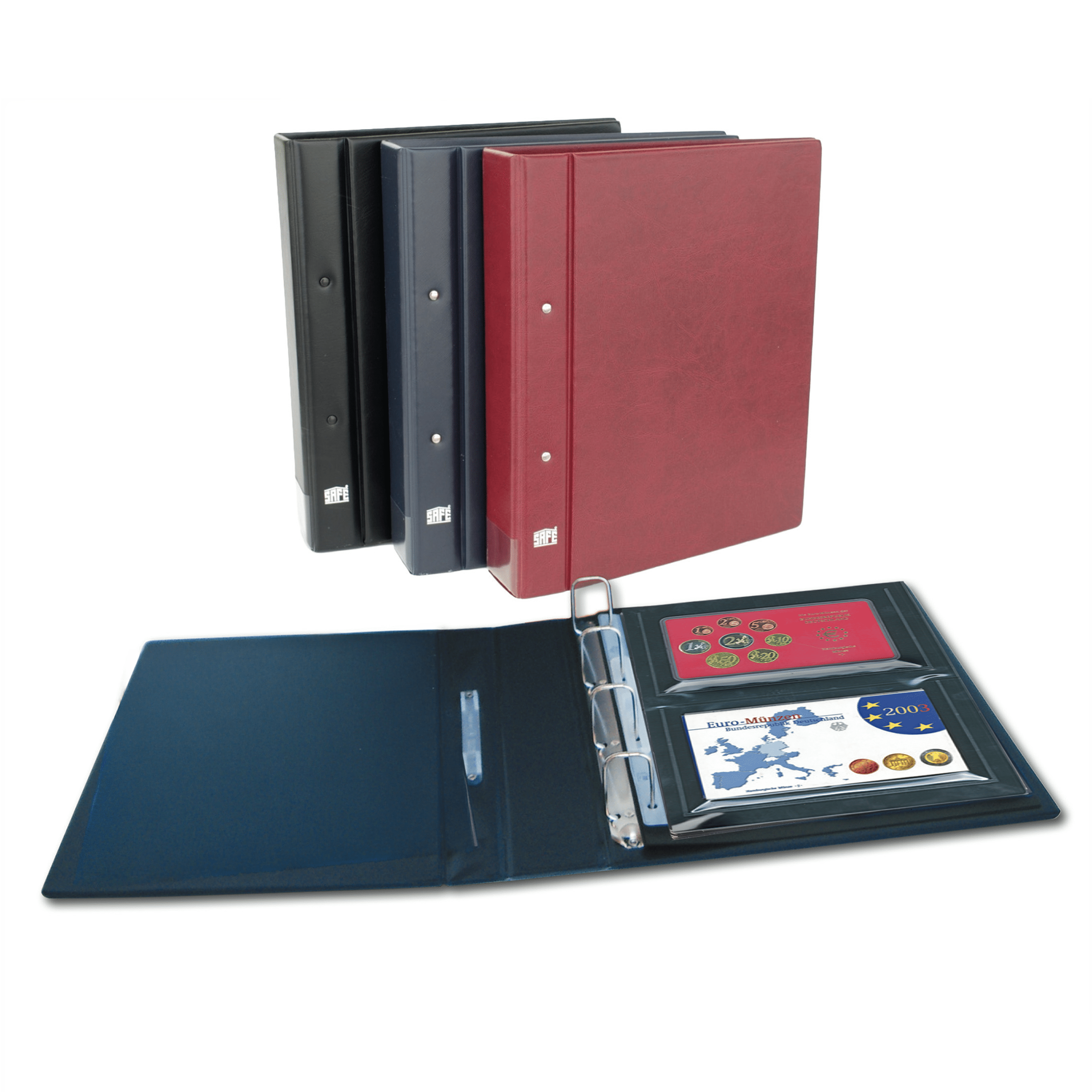 Three 4-ring albums with a blue album open, laid out in front, displaying 2 collectible coin proof sets.
