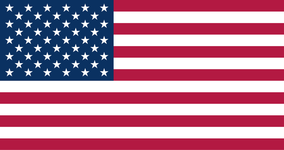 American flag with blue rectangle, white stars, and red & white stripes