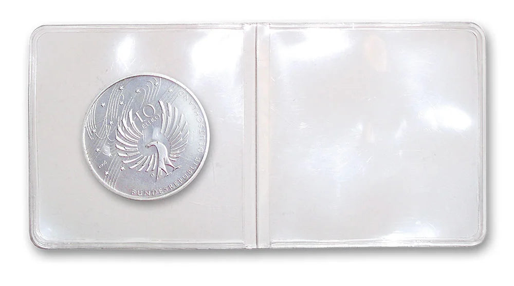 Silver coin in a protective double pocket 2x2 coin holder on a white background