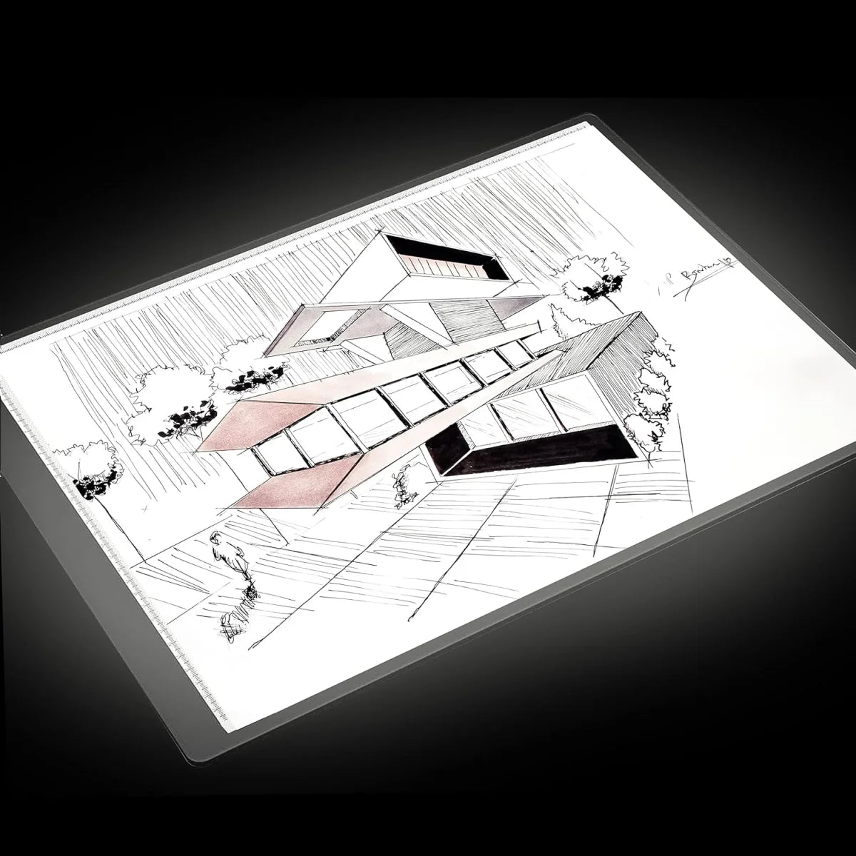 Architectural design on top of a light table on a black background