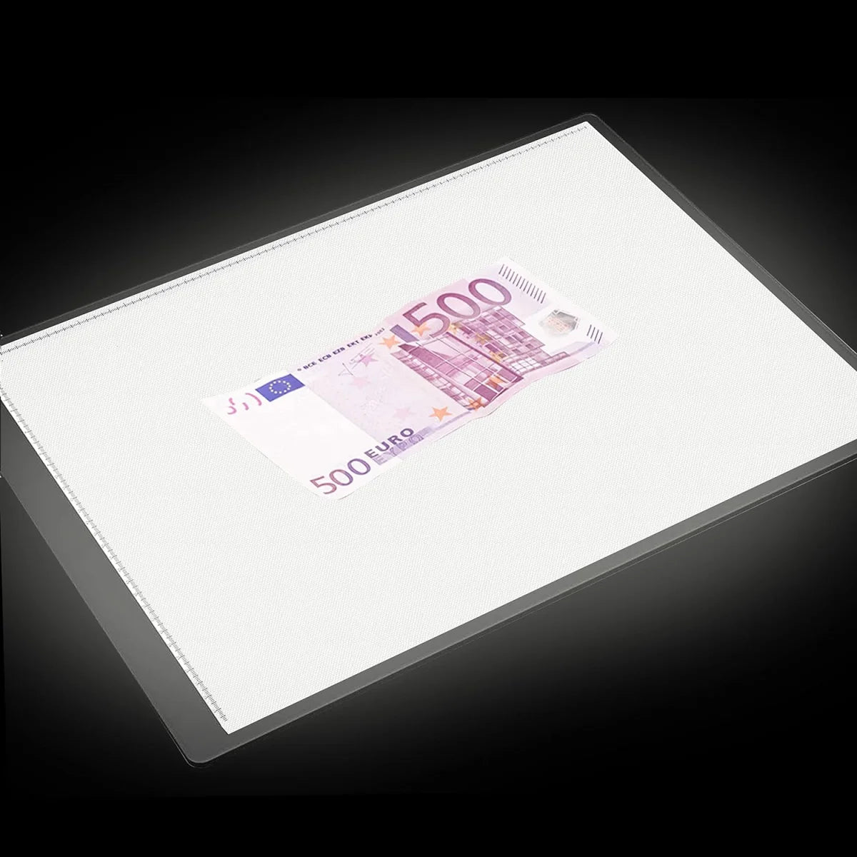 500 Euro banknote on top of a light table on a black background