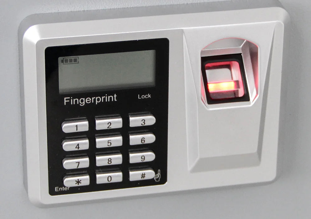 Close up of the fingerprint lock with digital numeric keypad on the gray safe