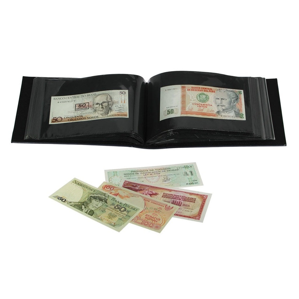 Open black wide spine collector album displaying pages with paper currency and banknotes spread out in front of the album on a white background