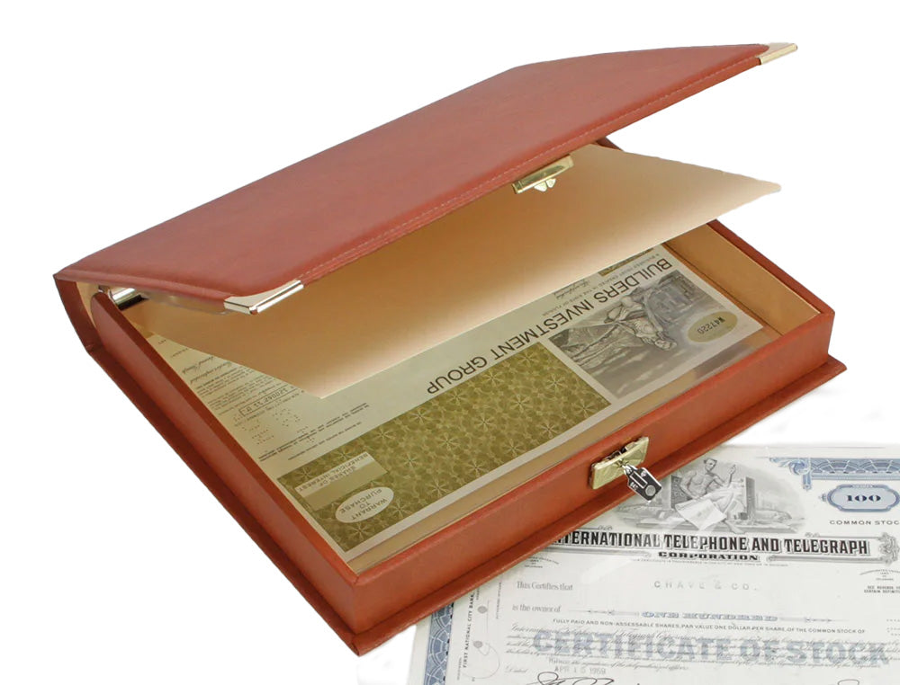 Open saddle tan binder with built in slipcase with gold accents and lock holding vintage documents on a white background