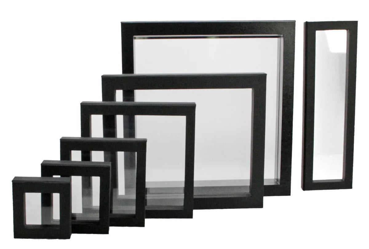 Set of black frames/shadowboxes with transparent window made of flexible film of different sizes on a white background