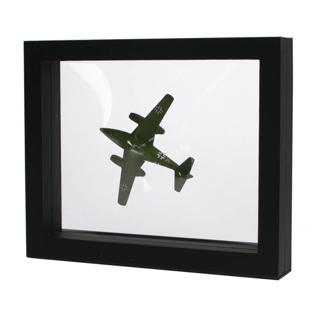 Black square frame/shadowbox with transparent window made of film that is molded to a model airplane on a white background