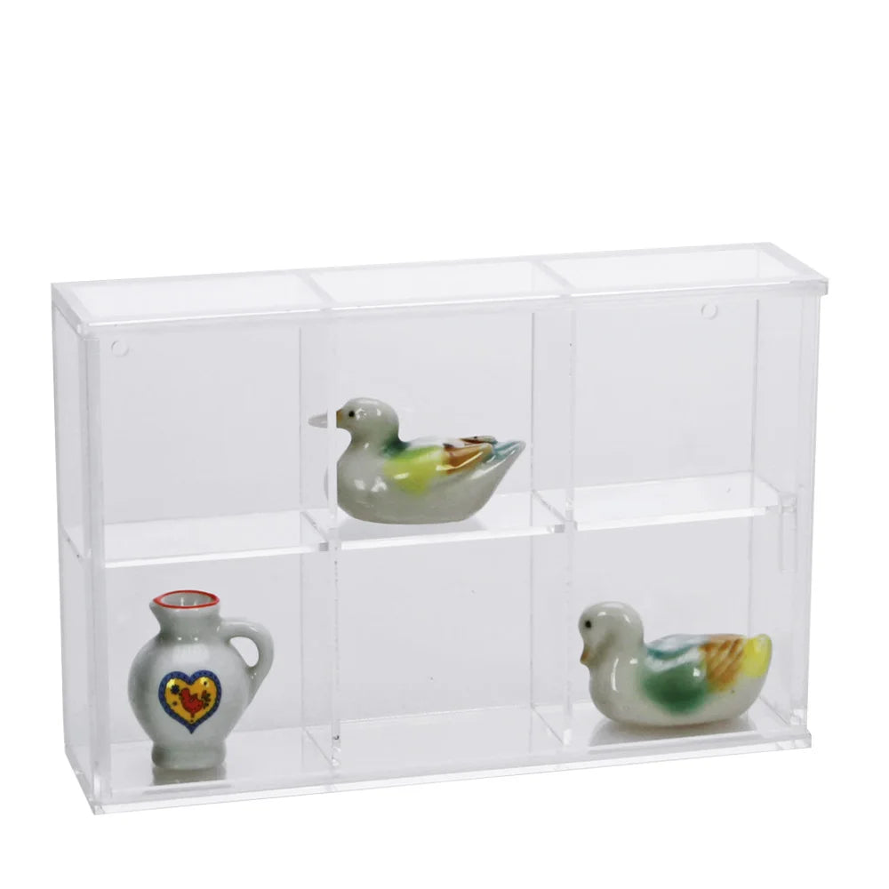 Clear acrylic display case with 6 compartments filled with various collectible mini ceramics on a white background
