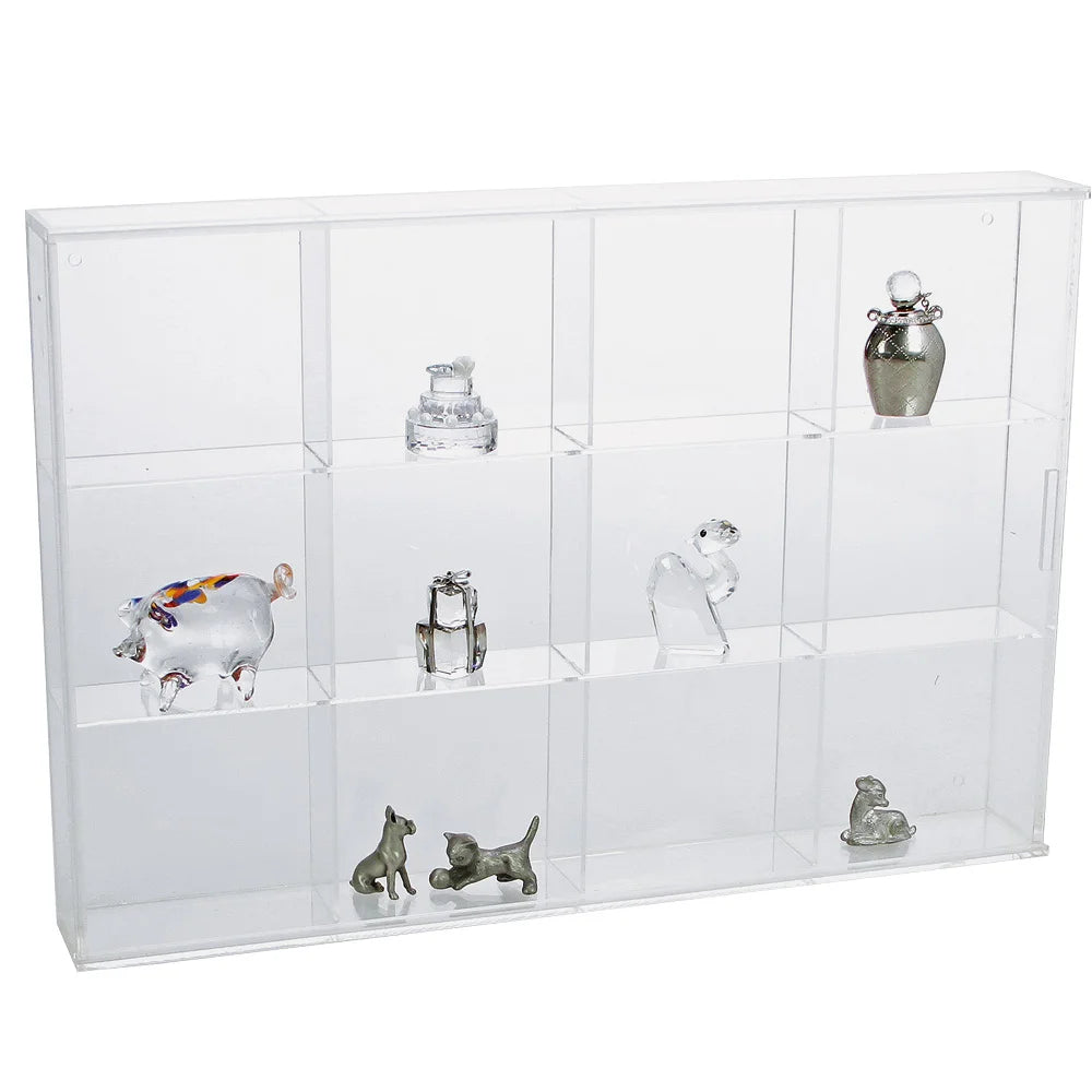Clear acrylic display case with 12 compartments filled with various mini sculptures & small collectibles on a white background