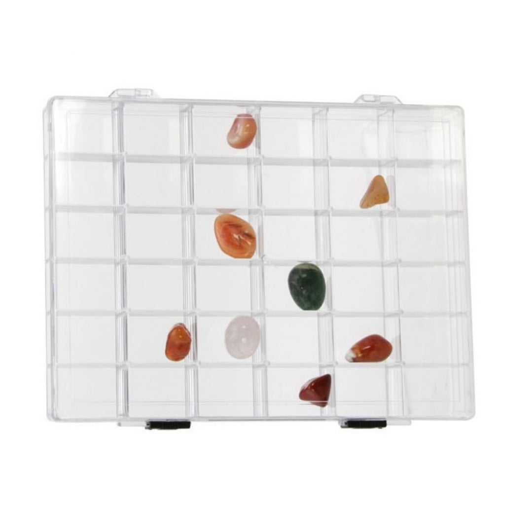 Collection of rocks & minerals in a clear acrylic box with 36 compartments on a white background