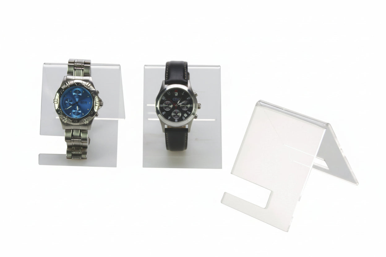 Two watches on wrist watch display stands with a white background