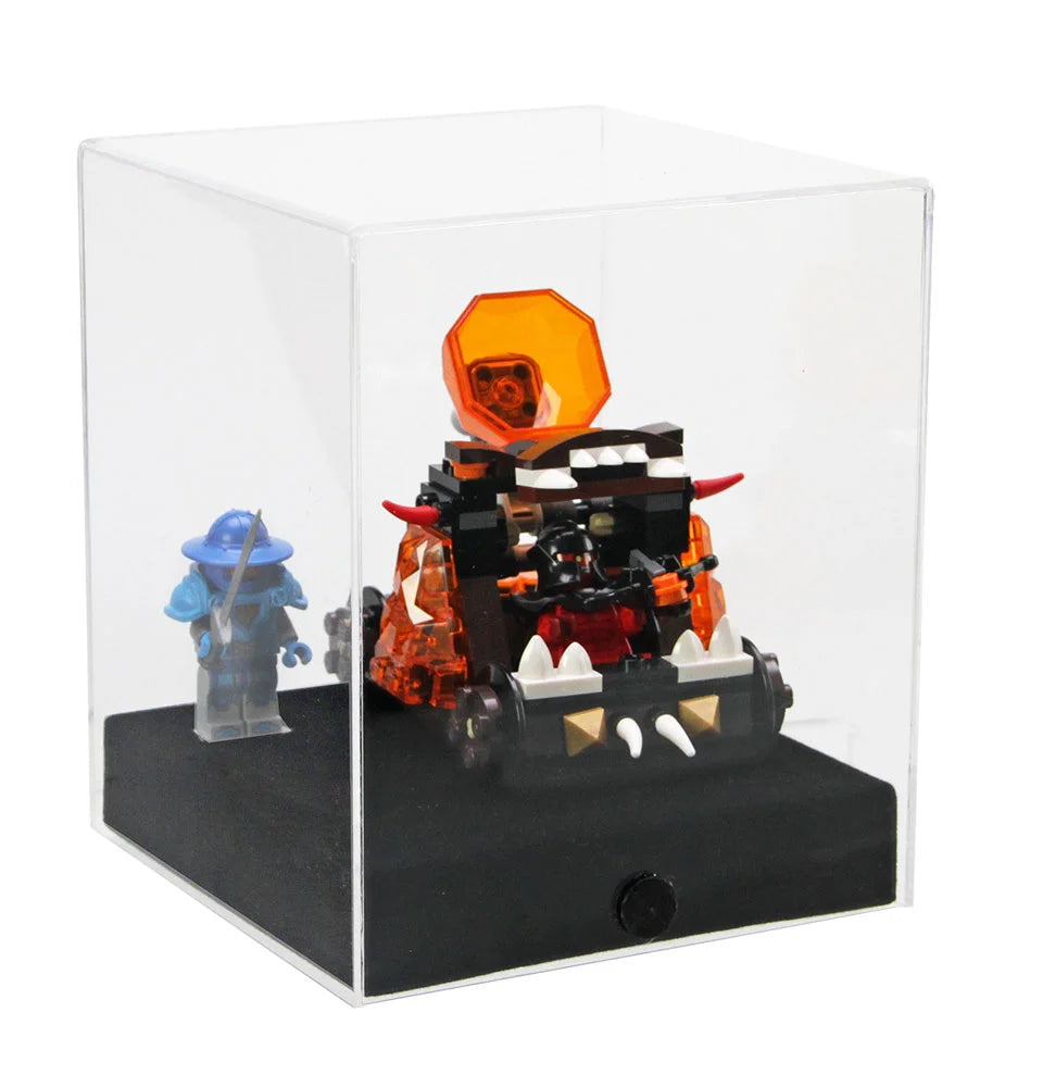 Clear acrylic display case filled with a LEGO mini build and a LEGO minifig on a white background