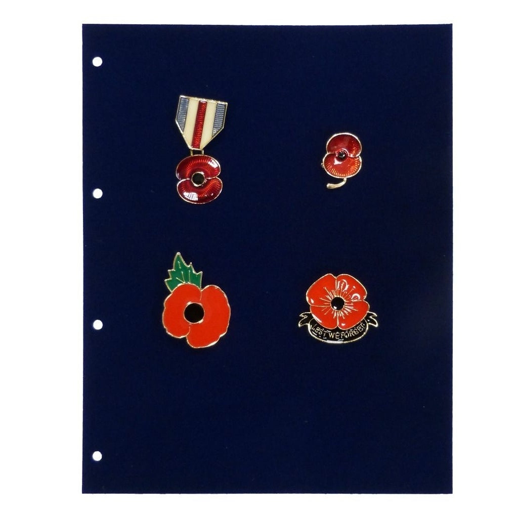 Four red poppy pins on a velvet dark blue page with four hole punches on a white background