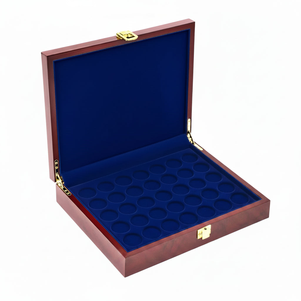 Open burlwood coin collection box with blue velvet trays on a white background