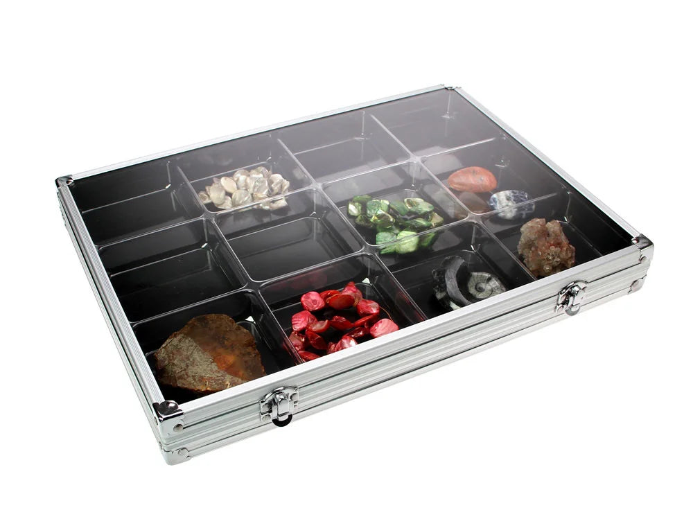Aluminum display case with 12 compartments filled with rocks & minerals closed with an acrylic lid on a white background