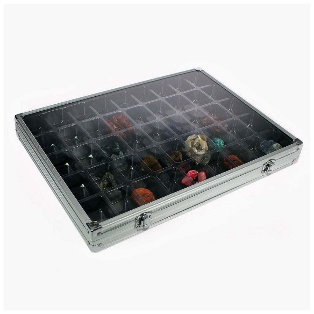 Aluminum display case with 45 compartments filled with rocks & minerals closed with an acrylic lid on a white background