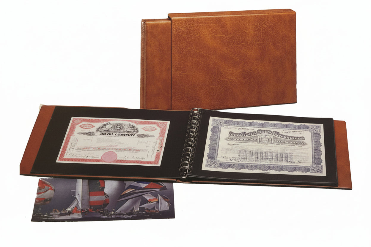 Tan collector album with open pages displaying documents in front of the same brown album with it's matching slipcase on a white background