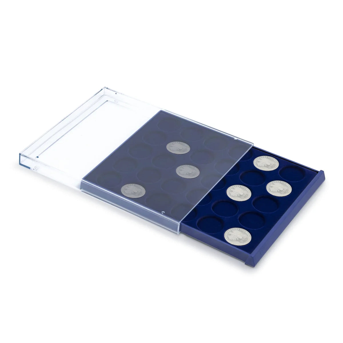Open acrylic stackable drawer unit with a blue velvet tray and circular compartments with coins on a white background