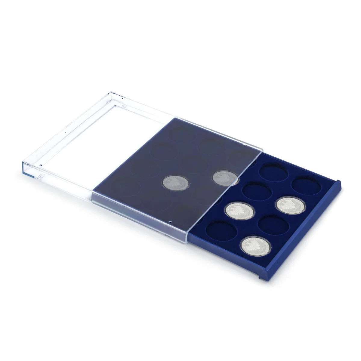 Open acrylic stackable drawer unit with a blue velvet tray and circular compartments with coins on a white background