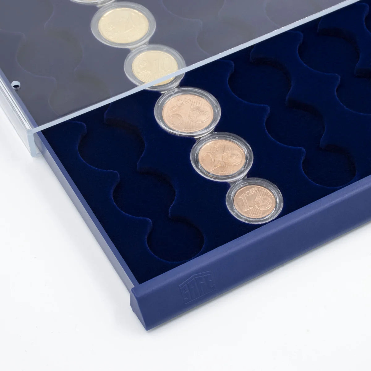Detail shot of open acrylic stackable drawer unit with a blue velvet tray and square compartments holding euro coin sets in capsules on a white background