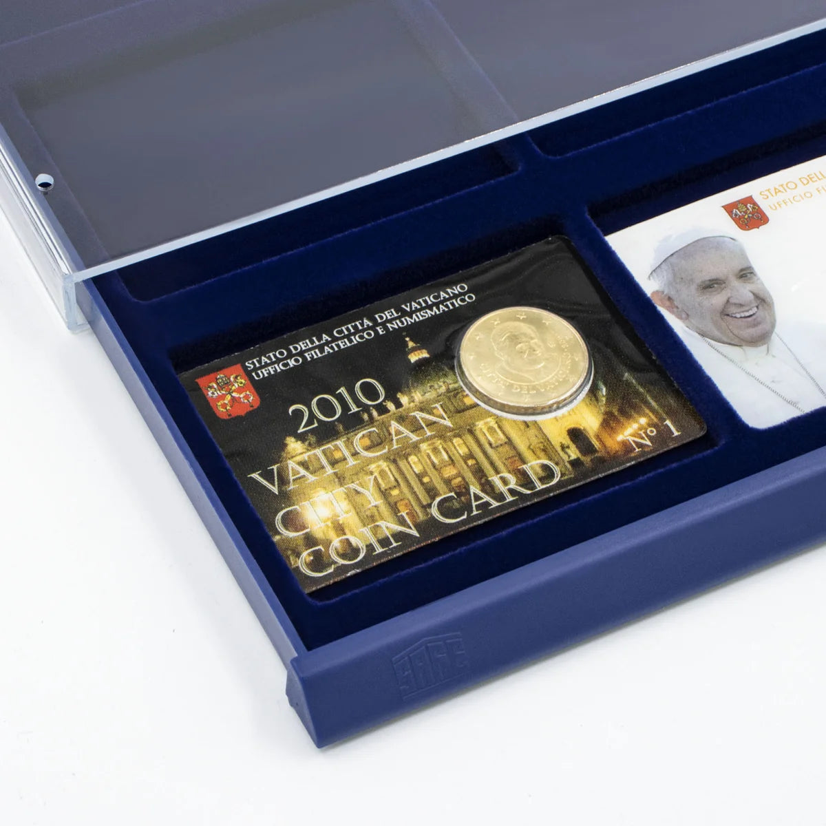 Detail shot of open acrylic stackable drawer unit with a blue velvet tray and rectangular compartments holding collectible coin cards on a white background