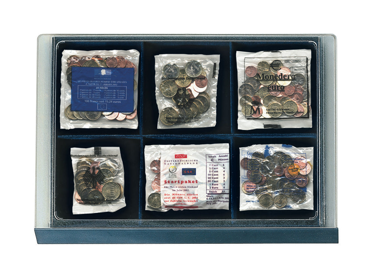 Overhead image of a collection of coins in clear bags within a display drawer unit on a white background