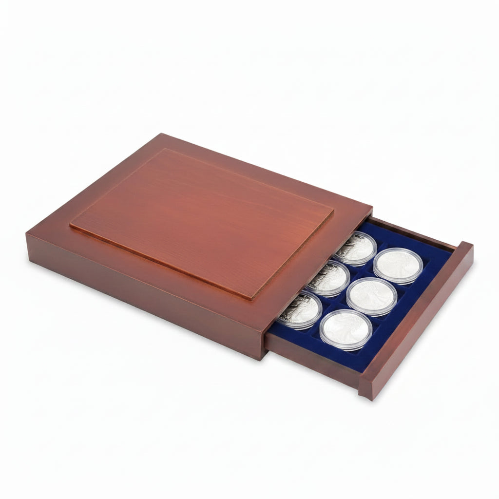 Open wooden stackable drawer unit with a blue velvet tray with square compartments for ASE coins in capsules on a white background