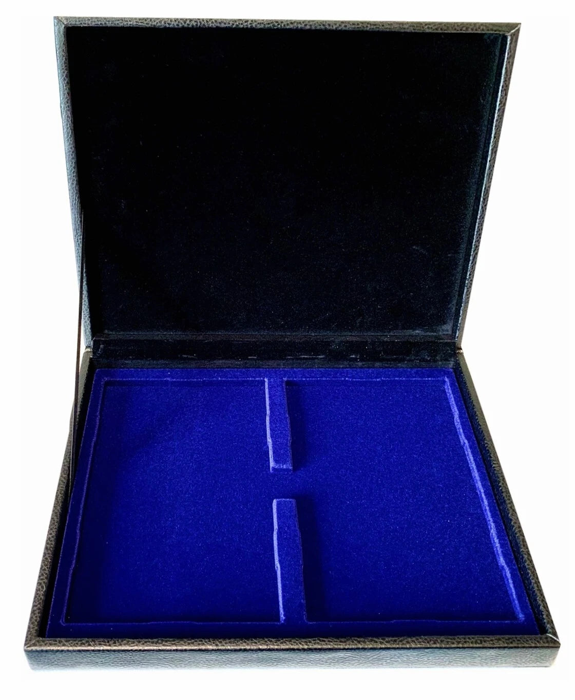 An open black leather coin box with a deep blue velvet interior with compartments for 2 coin proof sets, shown against a plain white background.