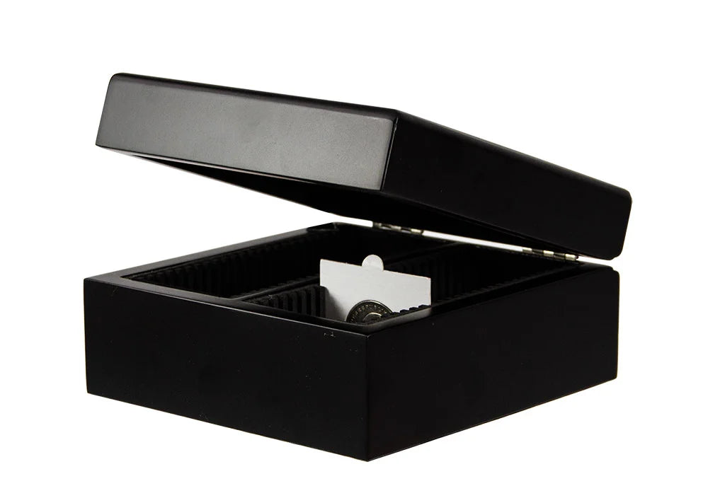 Black coin collection case with the lid open ajar showing a 2x2 coin flip on a white background