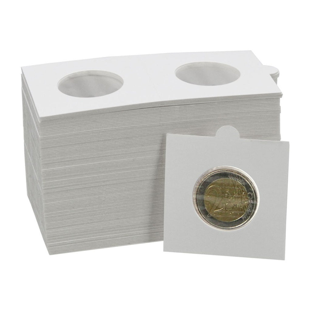 Stack of white self adhesive coin holders with a single holder showing a coin on a white background