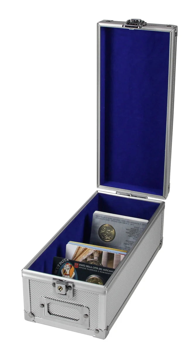 An open silver aluminum coin lockable case with a deep blue velvet interior lining, shown on a white background. Inside, a collection of coin cards are lined up.