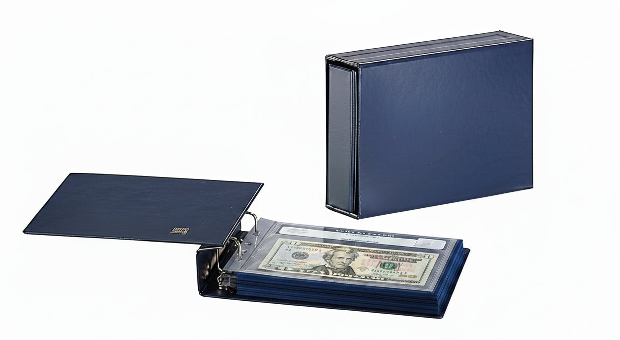 Open blue album with a graded U.S. bill and a closed blue album with slipcase on a white background